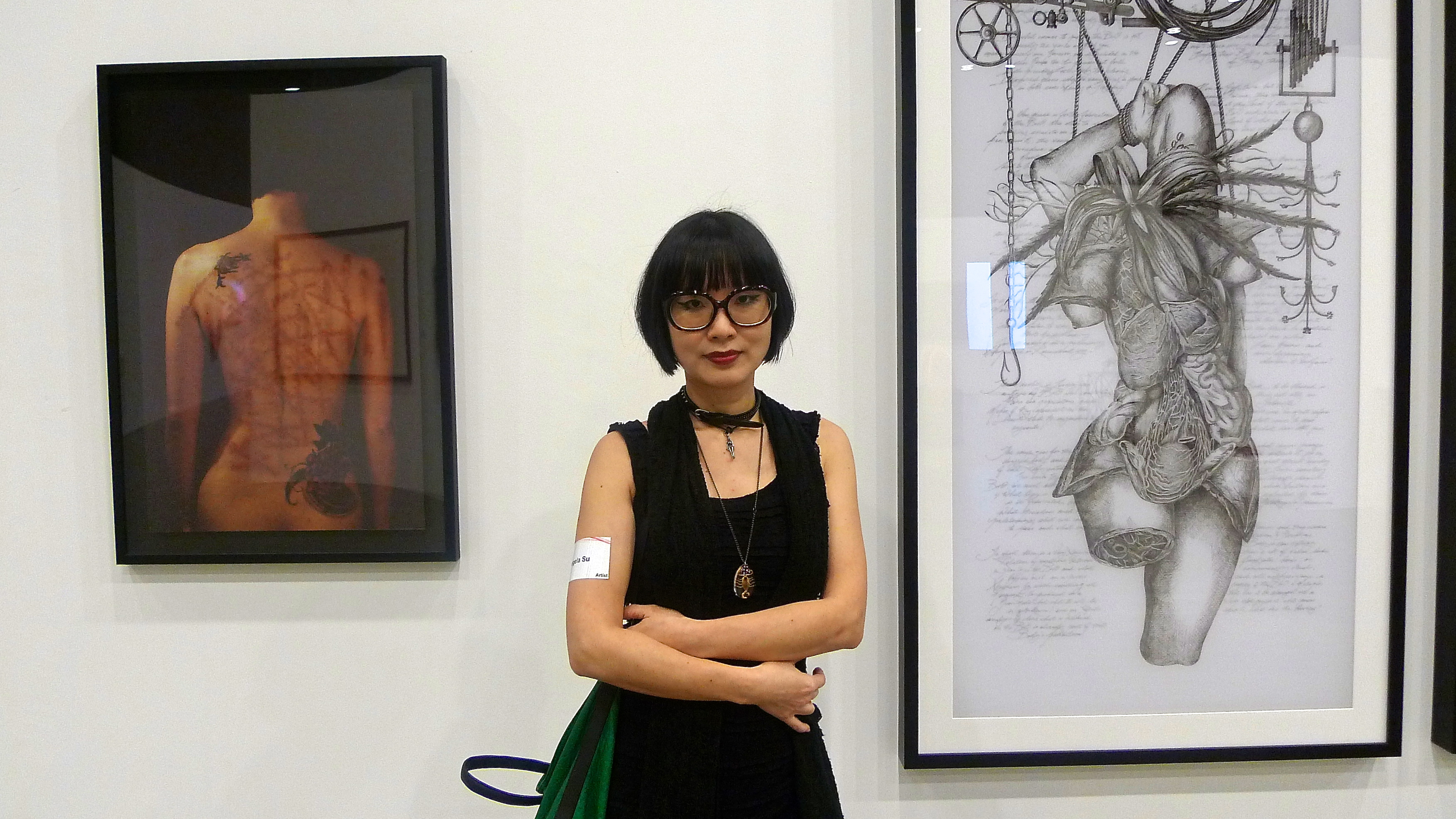 Angela Su in front of her 'Hong Kong Eye' works