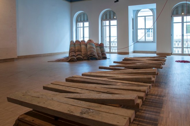 Hera Büyüktaşcıyan, ''Destroy your house, build up a boat,save life!''. Carpet, mechanism,rope,wood. A Century of Centurie', SALT Beyoğlu. Photograph: Mustafa Hazneci